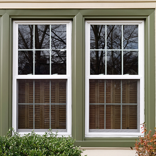 Three,New,Replacement,Windows,With,Green,Trim,On,Front,Of
